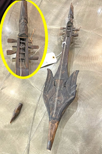 Hand carved wooden 4-string instrument bird shape